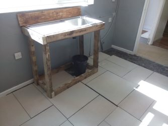 a basic sink set-up, sink and wood recovered from skips